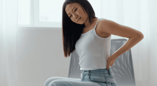 Woman struggling with back pain