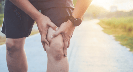 Runner clutching painful knee