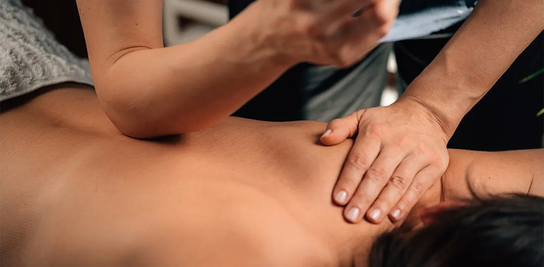 Active adult receiving soft tissue therapy for muscle and joint pain relief in Saddle River, NJ