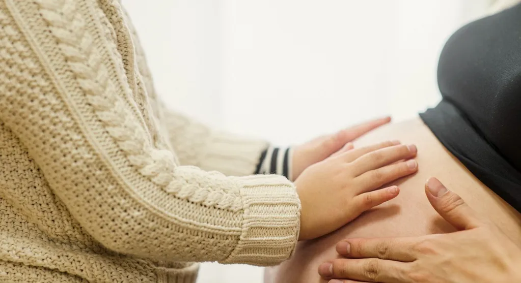 Expectant mother receiving prenatal chiropractic care